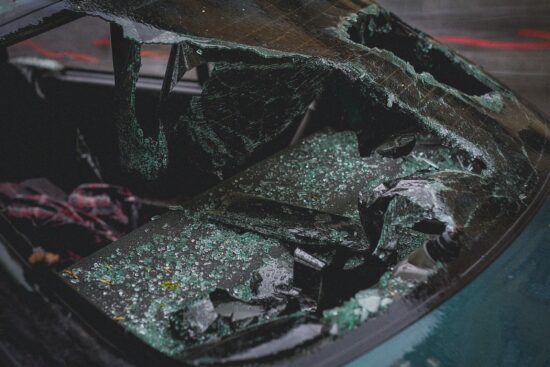 Shattered car windshield after a crash.