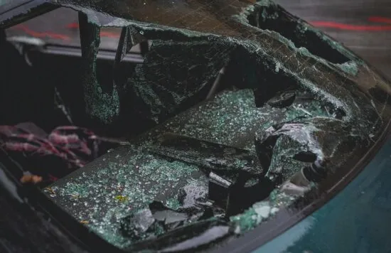 Shattered car windshield after a crash.