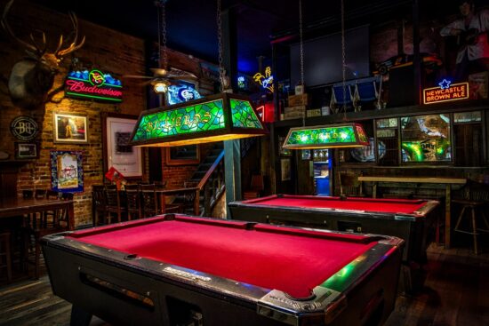 pool tables in dimly lit bar