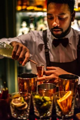 bartender pours a shot