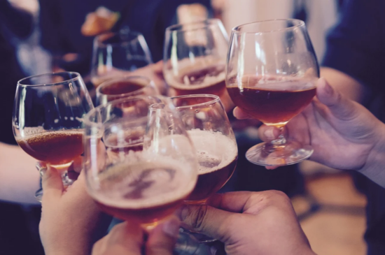 beer glasses in a toast