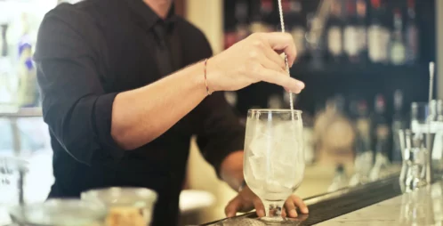 bartender stirring a drink