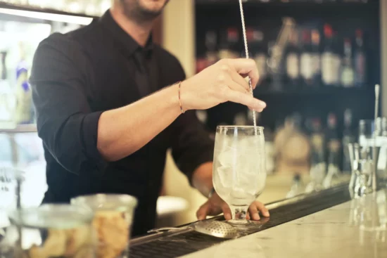 bartender stirring a drink